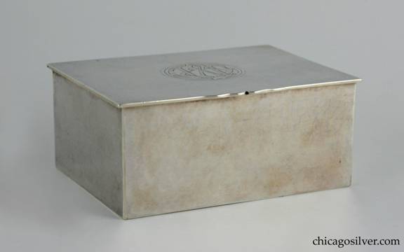 Kalo box, rectangular cedar-lined cigarette, hammered surface with overhanging lid on hinge.  Engraved stylized interlocking JWT monogram in oval on cover.  