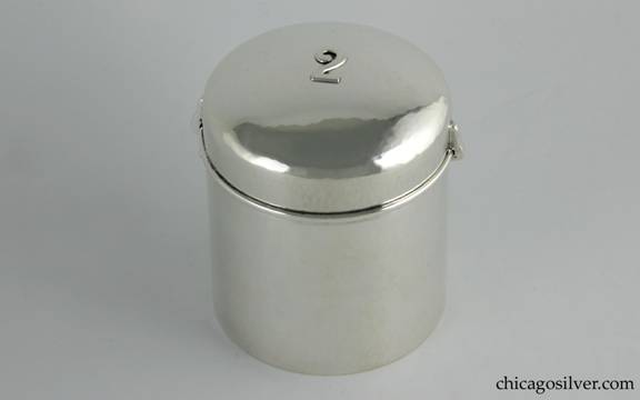Kalo box in the form of an air-tight canister, silver, cylindrical, with snug, domed lid that centers an applied "2" numeral.  