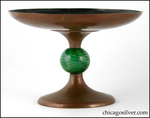Rebecca Cauman compote, copper, with flaring round top and foot joined by a large green glass ball with internal black design.  