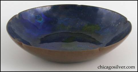 Rebecca Cauman bowl, round, copper, with five small inward-pointing flutes and dark blue and enamel interior that has added yellows and reds.  Small chip on side of enamel.  