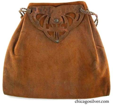 Forest Craft Guild handbag, ooze leather, trapezoidal, with hammered copper hardware at top.  One side has riveted triangular copper form with many cutouts.  Other side has simpler copper riveted form. Original twisted silk cord handle.  