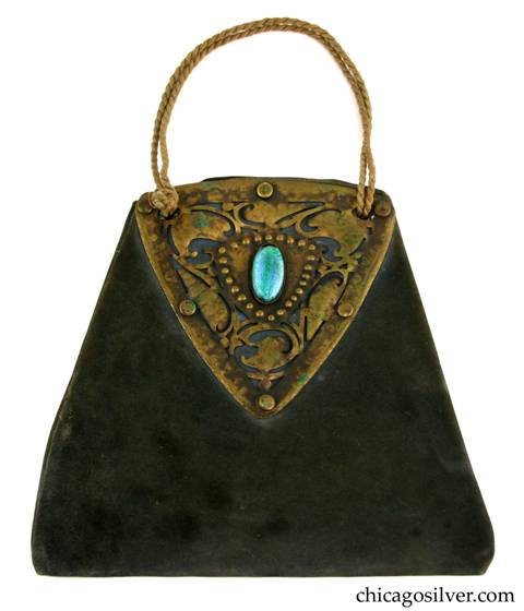 Forest Craft Guild handbag, trapezoidal, blue-grey ooze leather, lined, with large riveted and saw-pierced triangular brass hardware on both sides, each centering a blue-green oval bezel-set cabochon foil-backed glass stone.  Twisted silk cord handle.  