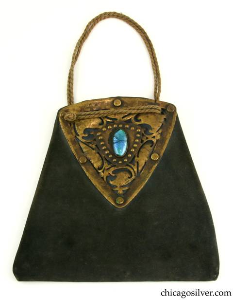 Forest Craft Guild handbag, trapezoidal, blue-grey ooze leather, lined, with large riveted and saw-pierced triangular brass hardware on both sides, each centering a blue-green oval bezel-set cabochon foil-backed glass stone.  Twisted silk cord handle.  