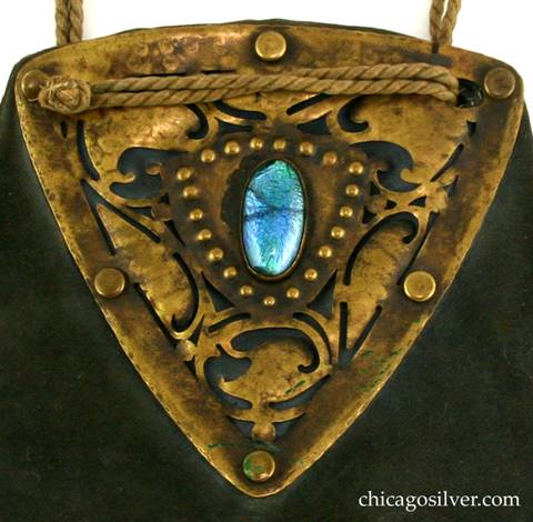 Forest Craft Guild handbag, detail, showing extensive cutout decoration and central foil-backed glass stone.