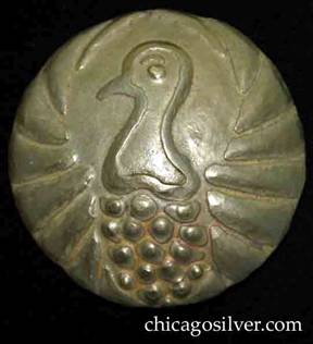 Forest Craft Guild brooch, brass, gilded, round, very large, with striking repousse image of bird's head and neck at center, with stylized feathers below and stylized wings arching around the sides to the top.