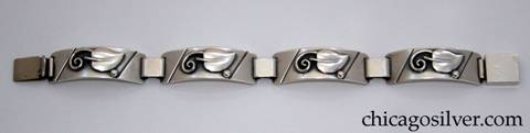Laurence Foss bracelet, four convex rectangular links each with an applied leaf with curving wire ornament and single bead.  Links are joined by heavy silver loops.