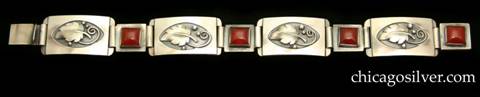 Laurence Foss bracelet with carnelians.  Four convex rectangular links each centering a recessed oval that contains an applied leaf with three silver beads and spiraling wire details, interspersed with four smaller square rectangular links each centering a square bezel-set carnelian stone.