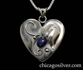 Laurence Foss pendant on chain, in the form of a small heart, with oxidized background, applied flower, bead and curving wirework ornament, and bezel-set oval cabochon lapis stone.  While most Foss jewelry has a soft "brushed" surface, this pendant is highly polished.