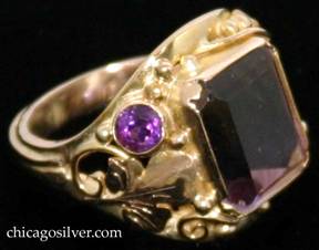 Laurence Foss ring, 14K gold, centering large purple/yellow ametrine rectangular faceted bezel-set stone, with a small round faceted citrine bezel-set stone on one side and a small round faceted amethyst bezel-set stone on the other, surrounded by lovely bead and wirework ornament and an applied chased leaf on either side.  Very much in the style of Edward Oakes. 