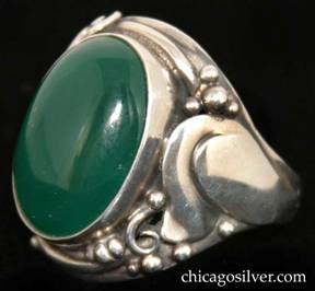 Laurence Foss ring, silver, large, with large oval bezel-set cabochon deep green onyx stone in prominent bezel frame surrounded by an applied stylized tulip flower and beads and wirework decoration on each side.  Heavy.  