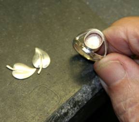 Laurence Foss at his workbench assembling a ring