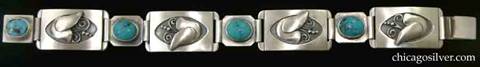 Laurence Foss bracelet, link, with turquoises.  Four large rectangular convex links alternating with four smaller ones.  The large links have applied stylized Jensen-type doves with beaded and curving wire ornament, inside an oxidized oval recessed frame.  The small links have oval bezel-set cabochon turquoise stones and clipped corners.  