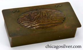Frost box, brass, with overhanging hinged lid and hand-worked, acid-etched domed oval decoration on lid of Viking ship at sea under cloudy sky.  Ooze leather lining. Riveted hinges.  Frost catalog calls this a cigarette box.