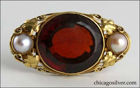 Edward Oakes gold pin with faceted orange-red hessonite garnet, flanked by two pearls 