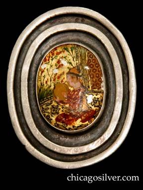 Mary Gage pin, oval, with two thick silver rings centering a bezel-set multi-color oriental-themed painting or enamel