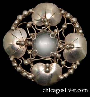 Mary Gage brooch, with four chased lily pads centering a round moonstone or rock crystal on a round frame 