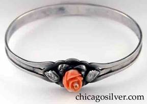 Kalo bracelet, bangle, with carved pink coral rose centered by pierced cut-out and applied silver leaves