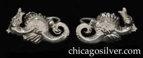 Kalo earrings, pair, screw backs, in the chased and cutout form of seahorses with curving tails