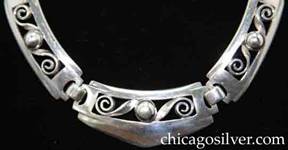 Kalo necklace / choker composed of eleven rectangular links each centering a silver bead flanked by two wirework scrolls on a cutout frame 