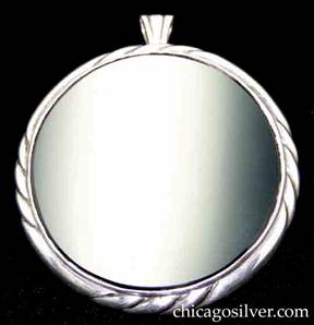 Kalo brooch / pendant, very large, round flat onyx stone with silver frame, with four chased diagonal lines around edge repeated at four regular intervals.  Hinged bale in back for use as pendant.  Heavy.