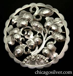 Kalo brooch, round, very large, nice design of cutout flowers and acorns growing out of tree with semicircular row of beads at bottom and a scalloped edge.