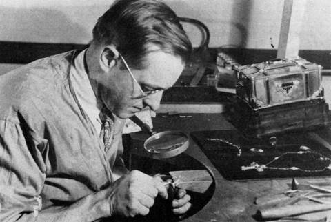Edward Oakes at work, 1930, with his jeweled casket is in the background.