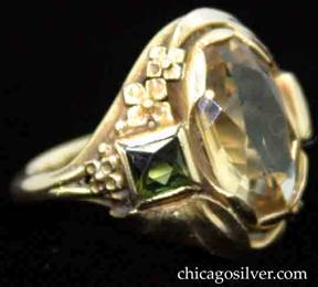Ring, by Edward Oakes, hand wrought in 14K green gold with central oval faceted citrine, flanked by a square green tourmaline on either side with delicate gold work depicting flowers and leaves.  Beautifully crafted, very delicate.