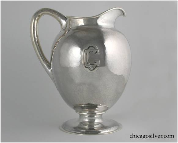 Kalo pitcher, presentation, large, on round pedestal base.  Egg shaped body with high spout and looping hollow handle.  Applied "CGC" mono (Chicago Golf Club).  7-3/4" W and 9-5/8" H.  STERLING / HAND BEATEN / AT / KALO SHOPS / PARK RIDGE / ILLS. / 9305