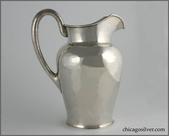 Kalo pitcher, water, vase form with raised spout and applied wire at rim, high looping hollow handle.  Engraved on bottom "A C February 25, 1933."  Hammered surface.  8-3/4" H and 7" W.  STERLING / HAND WROUGHT / AT / THE KALO SHOP / L362 / 3-1/2 PINTS