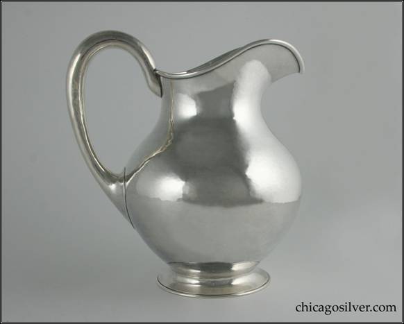 Kalo pitcher, water with nicely hammered surfaces on pear-shaped form with looping hollow handle and flared foot.  9" H and 8" W.  STERLING / HANDWROUGHT / AT / THE KALO SHOP / 2 P / 4-1/2 PINTS