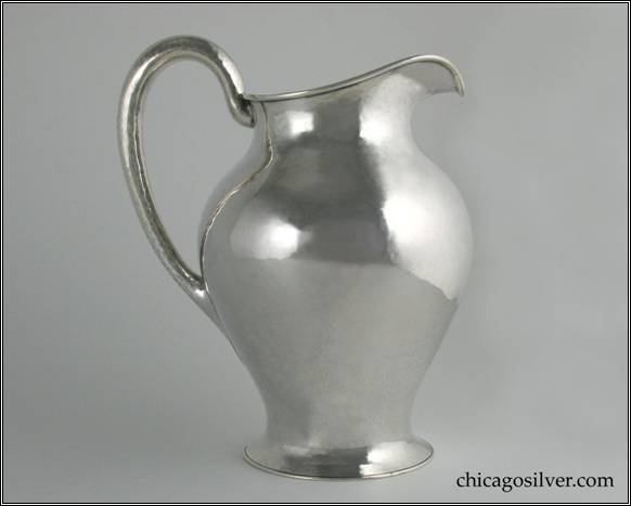 Kalo pitcher, water, nicely hammered surfaces on vase-like form with looping hollow handle and flared foot.  9" H and 7-1/2" W.  STERLING / HANDWROUGHT / AT / THE KALO SHOP / 9 M / 4 PINTS