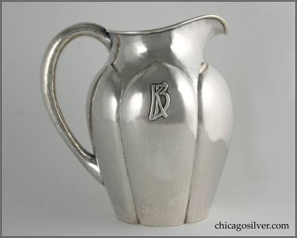 Kalo pitcher, water, with broad, paneled fluting and tapered neck and long hollow handle.  Flat bottom.  Applied "KB" mono on side.  Nicely hammered.  8-5/8" H and 8-1/4" W.  STERLING / HAND WROUGHT / AT / THE KALO SHOP / 4828L