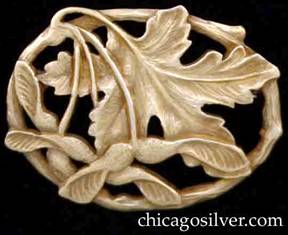 Potter Studio brooch, gold, with maple leaves and winged seeds on oval frame made to look like a curved twig.  Hammered and carved details.  Thick and very heavy.  