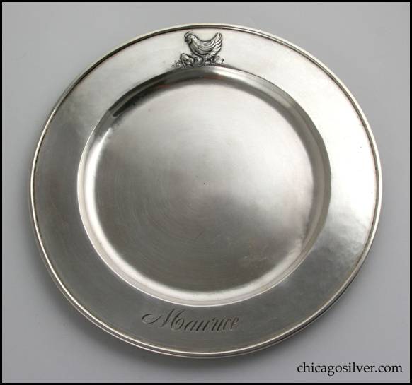Kalo plate, child's, round, with slightly raised border with repousse hen and chick.  Engraved name MAURICE in script opposite hand work
