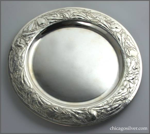 Kalo tray, one of two, round with decorated borders.  This with chased morning glory design