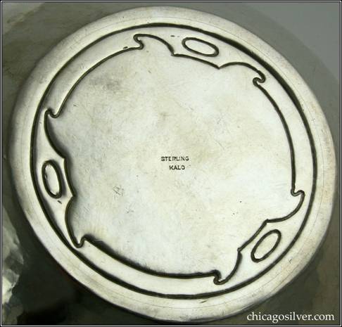 Kalo bowl, early, small with self-foot, flared sides, chased geometric design on bottom, applied wire to rim, hammered surface, engraved Gothic EBM mono on side  -- bottom view