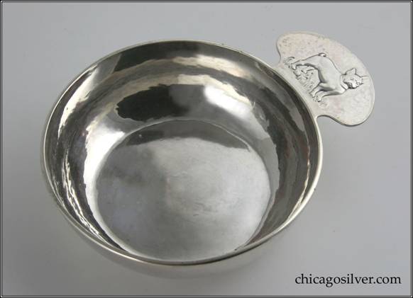 Kalo porringer, round, flat bottom form with tab handle and applied wire rim.  Handle has chased and repousse bulldog decoration.  Engraved presentation on side "BOAZ / MAY 28, 1947"  