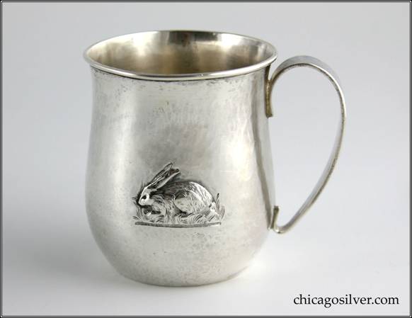 Kalo cup with  bulging bottom that tapers upward and then flares out at top, with looping strap handle, applied wire to rim, repoussé rabbit on one side, engraved "C. E. D.  JR." on the other side