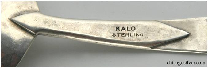 Kalo spoon, with round bowl and bezel-set green onyx cabochon stone at end of handle.  Very early.  Unusual method of joining bowl to handle.  7" L and 1-3/16" W.  Marked KALO STERLING