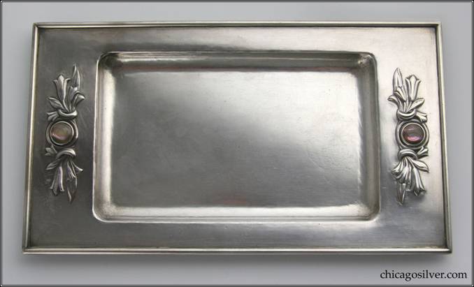 Kalo tray, rectangular, with raised flat edges and applied wire to rim, repouss floral pattern centering bezel-set mother-of-pearl stones at both ends.  Heavy and beautiful.  8-3/16" W and 4-3/4" H.  Marked:  STERLING / HAND WROUGHT / AT / THE KALO SHOPS / CHICAGO / AND / NEW YORK / F195