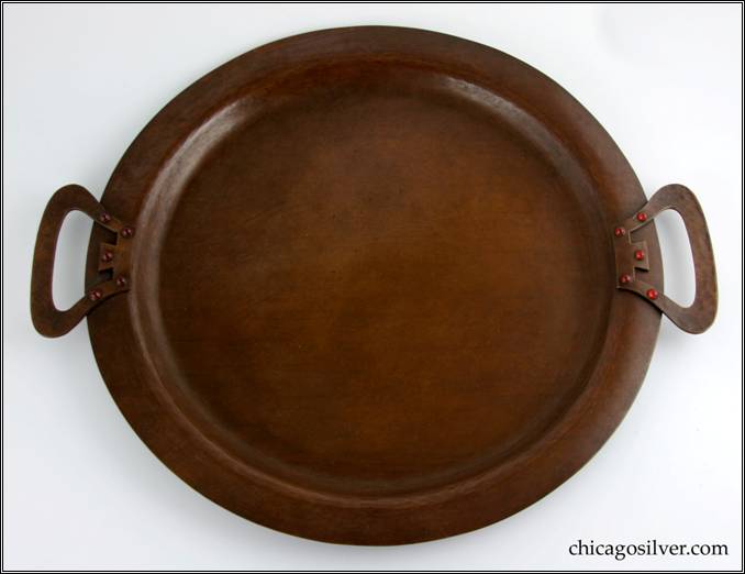 Kalo tray, copper, large, with applied strap handles with geometric pierced shape, broad flat bottom with raised border, five bezel-set carnelian cabochons on each handle.  17-5/8" W across handles, 14-13/16" W.  Marked:  KALO