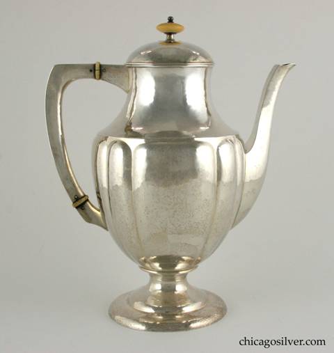Kalo coffee pot, fluted, with flat top hollow handle and complementing spout.  Ivory insulators and turned finial.  Keyed lid.  Engraved "March 3, 1891 Charles H. Sergel = Annie Myers Sergel March 3, 1916" on the underside.  9" W and 11" H.  Marked:  STERLING / HAND WROUGHT / AT / THE KALO SHOPS / CHICAGO / AND / NEW YORK / 961 / L