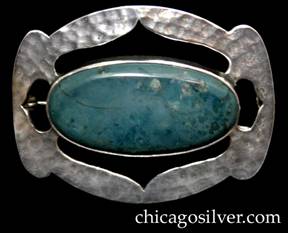 Art Metal Studios brooch / pin, oval, with ends that have small lobes top and bottom, centering large bezel-set oval cabochon green-blue stone, with curving pointed cutouts surrounding it on all four sides.  Heavily hammered surface.