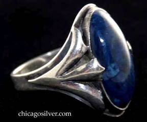 Art Metal Studios ring, with large dark blue oval bezel-set stone, three applied "fingers" on each side, adjustable back with overlapping ends.