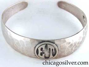 Art Metal Studios bracelet, with open back and tapering rounded ends, applied "ET" mono in circle, nice hammering.