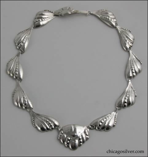 Peer Smed necklace, silver, composed of ten links formed in the shape of raised leaves with circular accents, centering a slightly larger pentagonal pendant in similar decoration