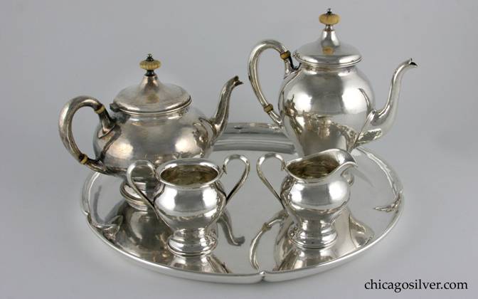 Kalo coffee set, three (4) pieces, small-scale, composed of coffee pot, tea pot, sugar, and creamer, on conforming round lobed Kalo tray