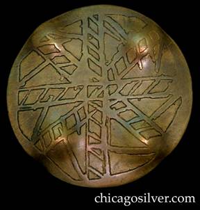 Pin, brass, round, with acid-etched design somewhat resembling ladders or an abstract snowflake.