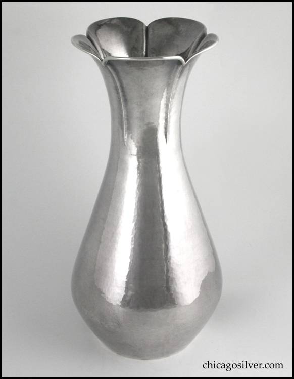 Kalo vase, large, with flat bottom, lower bulge, sides tapering and flaring at ruffled and fluted rim, applied wire at rim.  Hammered surface.  13-1/4" H and 6" W at widest part of base and 5-3/8" W at top.  Marked:  STERLING / HAND WROUGHT / AT / THE KALO SHOP / 14